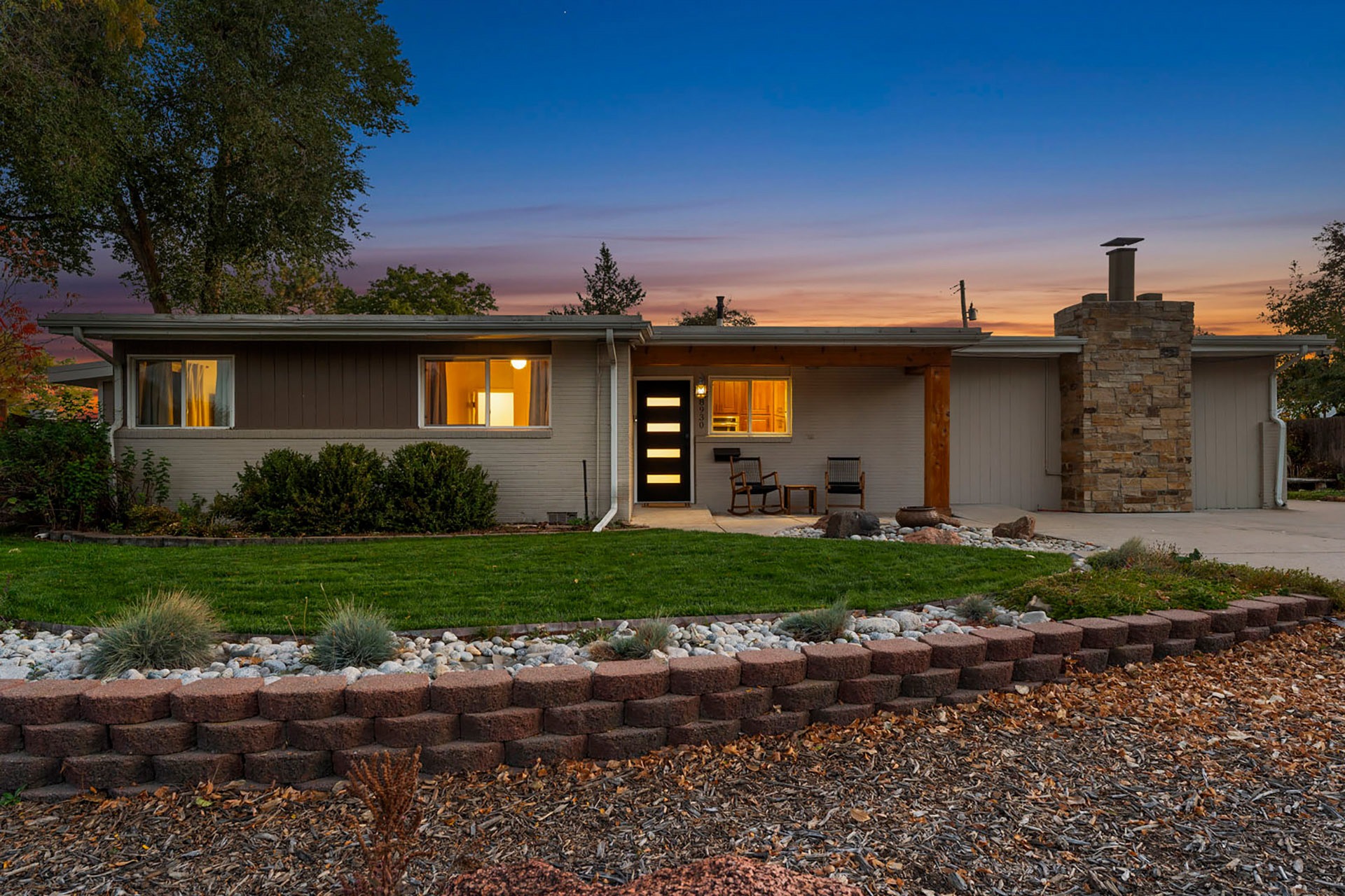 Front exterior twilight photo of a single-story Castle Rock home with professional real estate photography